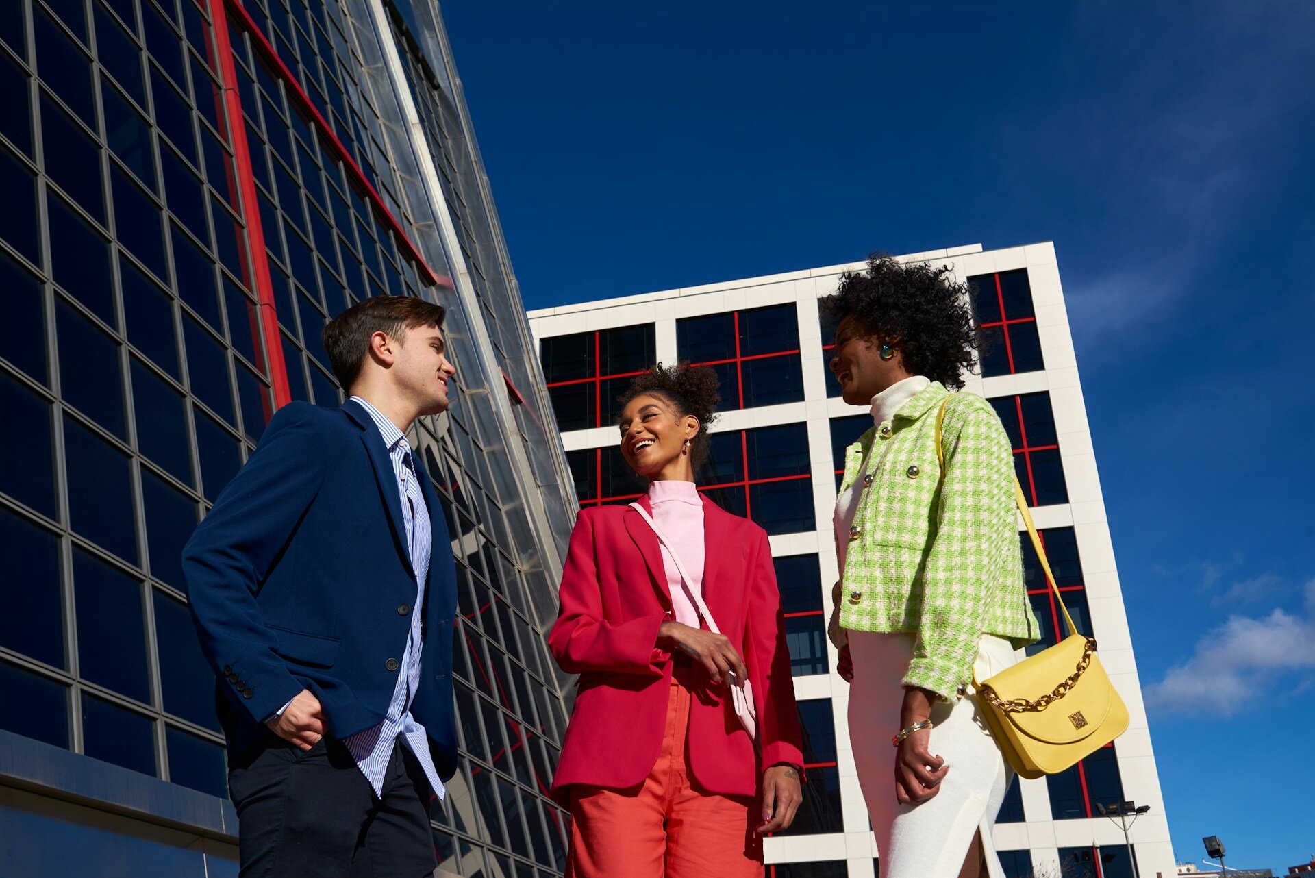 a-group-of-three-people-standing-next-to-each-other